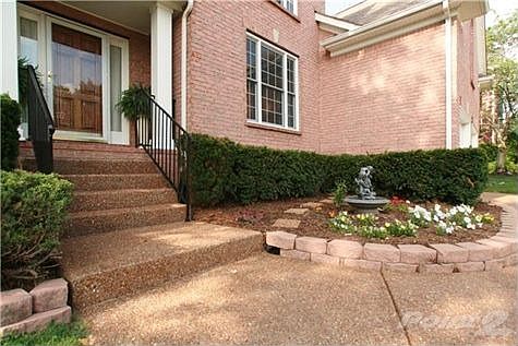 Incredible entrance with this lovely flowerbed just full of color. Just a few steps will lead you in