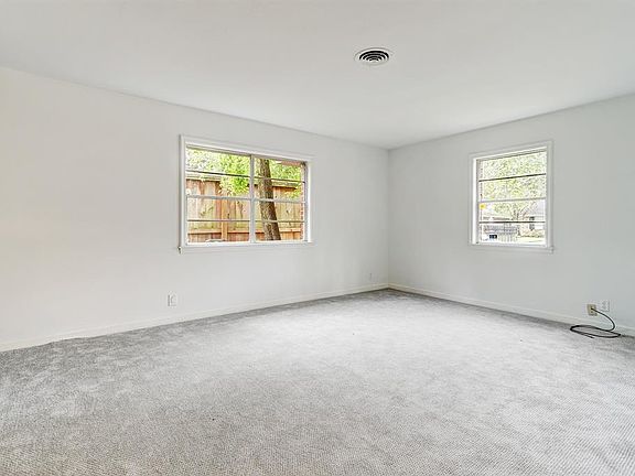 Living room as lots of windows. Fresh interior paint! Neutral colors.