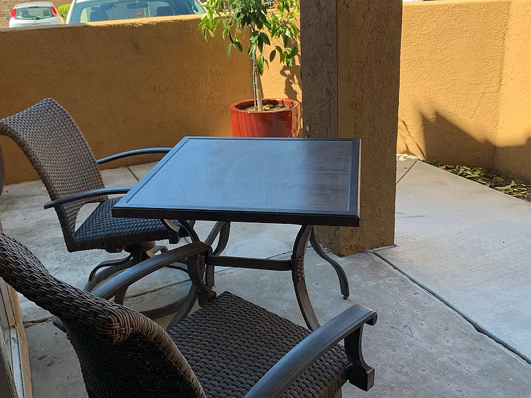 One side of the large patio. Not pictured is the oversized patio on the other side of the slider door facing a small private walkway between units.