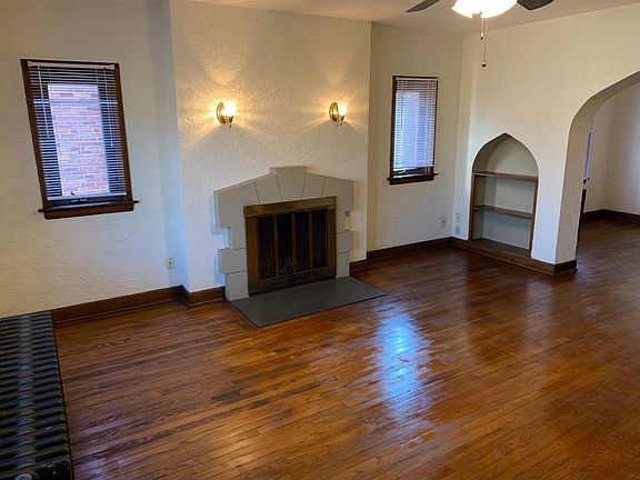 Living room, hardwood floors and double pane vinyl windows.