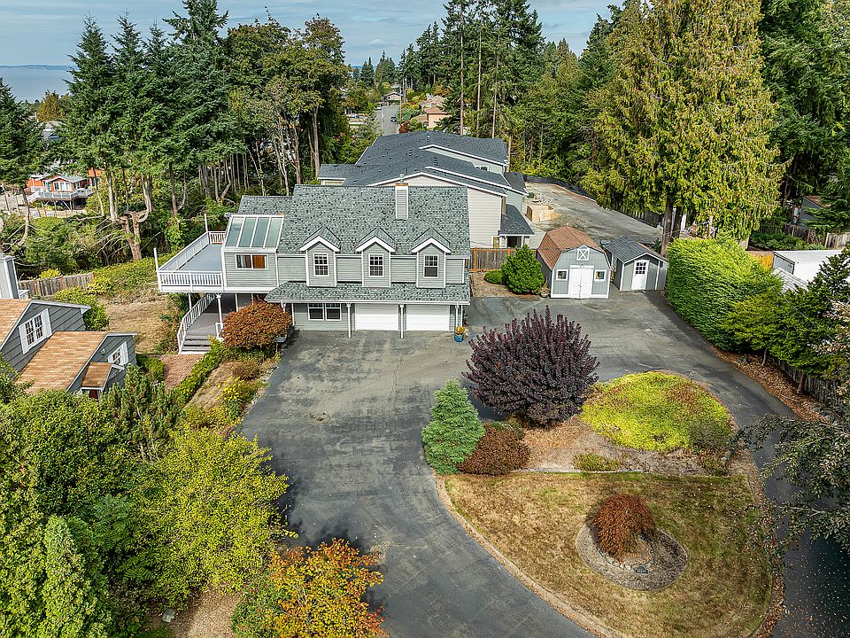 Large house with large driveway, plenty of outdoor parking and two car garage