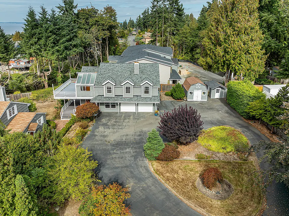 Large house with large driveway, plenty of outdoor parking and two car garage