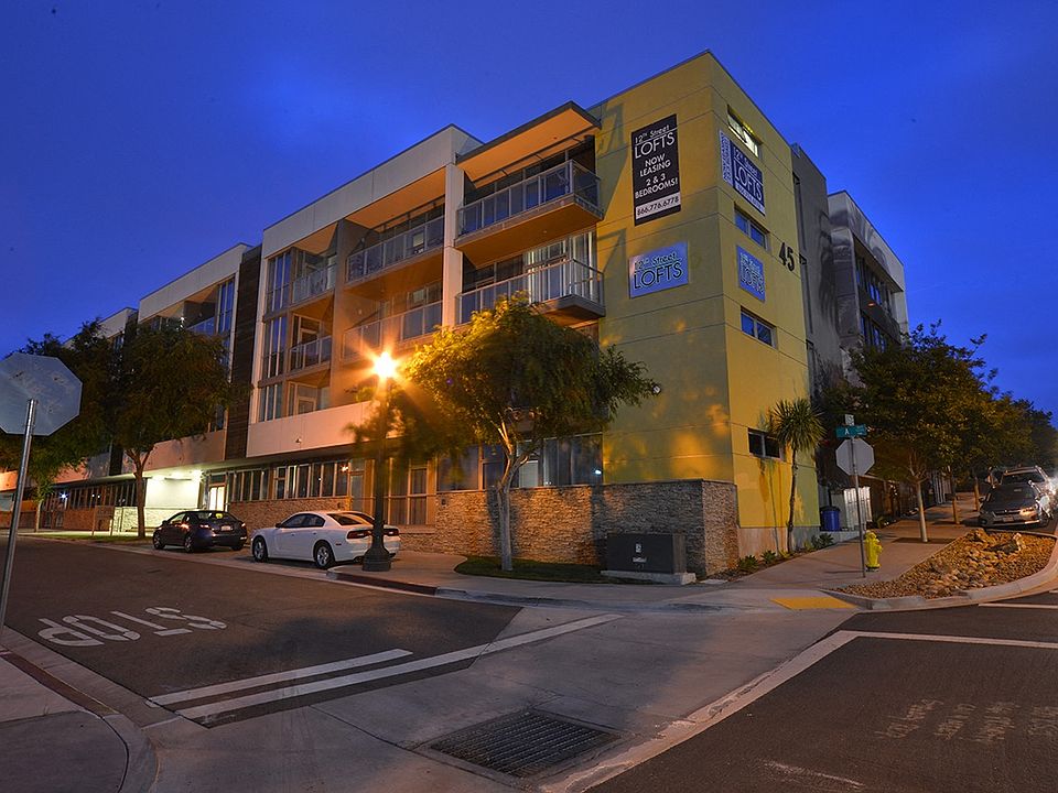 Quaint street lighting and large balconies at 12th Street Lofts in National City, California.