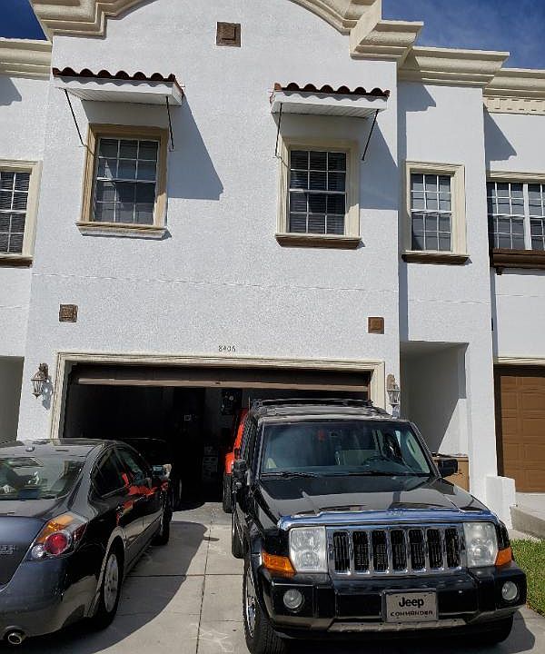 Front of the home 2 car garage plus parking for two others..