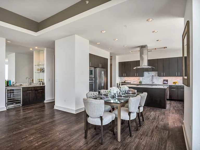 Kitchen and dining areas ideal for entertaining, featuring wet bars and wine chillers, spacious kitchen islands and a suite of premium appliances