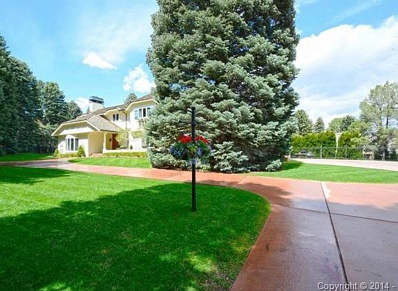 Front of home and circular driveway