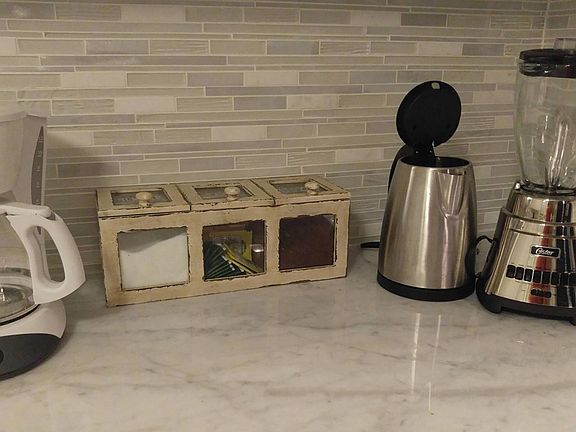 Kitchen appliances included, pots and pans and plates as wel