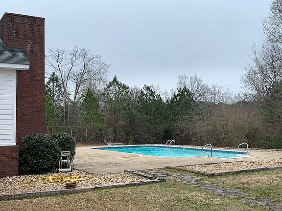 Back of house with pool