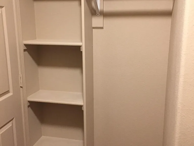Walk-in closet in 1st master bedroom