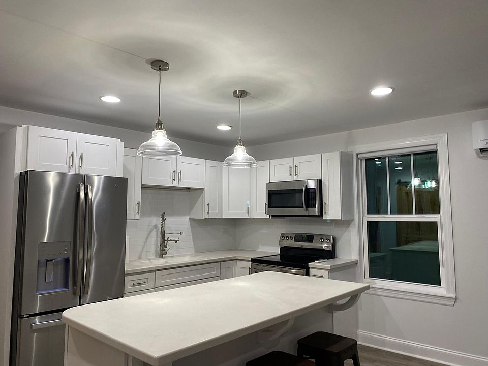 Eat-in kitchen with Corian countertops