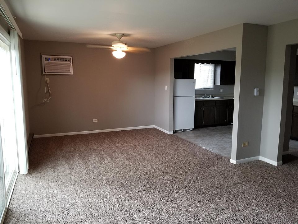 Living Room, Dining Space and Kitchen. Door to deck on left
