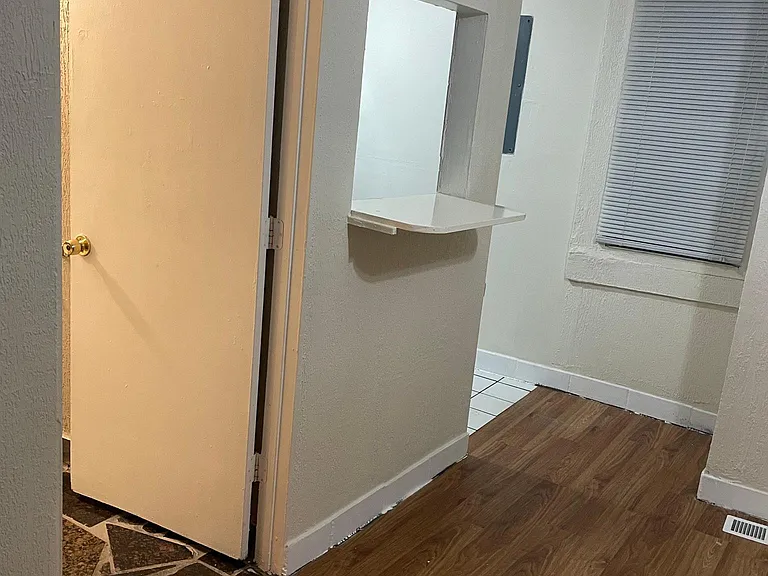 Bathroom on the left, kitchen on the right in living room