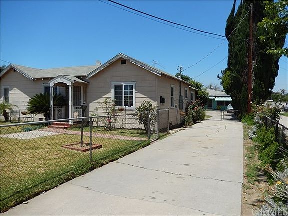 Looking down driveway to second home in rear