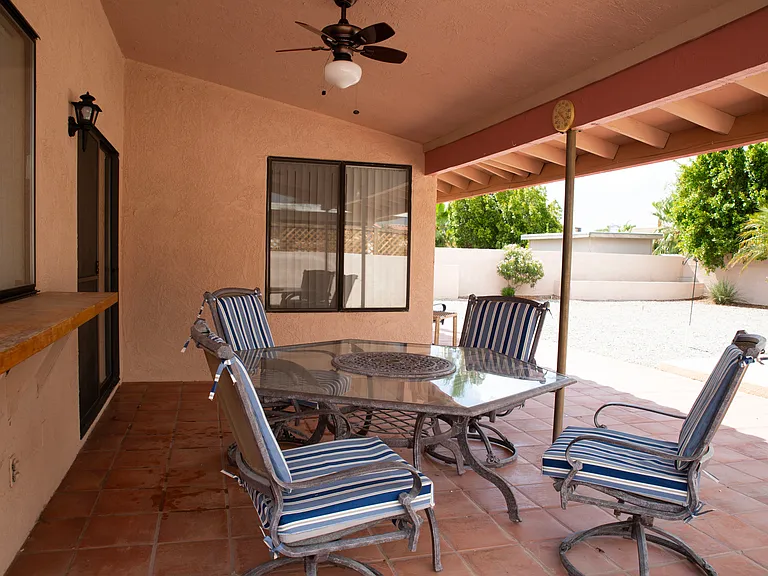 Roomy porch with ceiling fan.