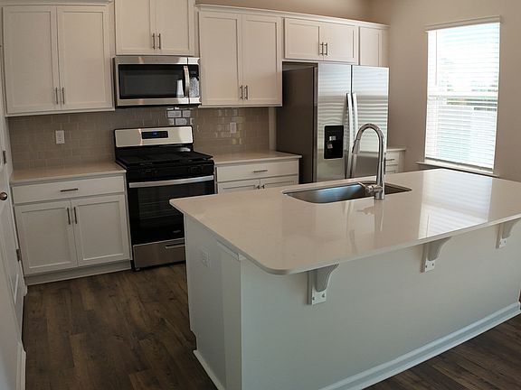kitchen, quartz countertops, stainless steel appliances