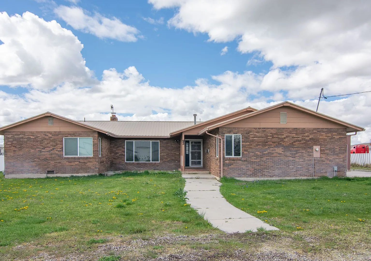 Spacious 3 Bed 2 Bath Brick Home with RV Parking, Shop Space & Large Yard in Tremonton! — Photo 4