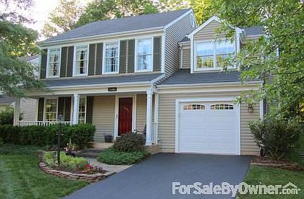 Farmhouse with front porch.