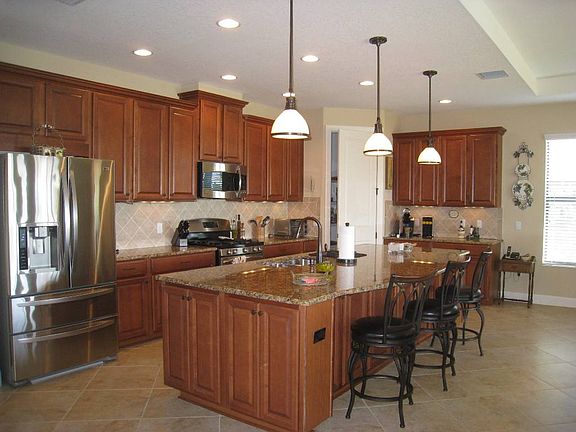 Kitchen area overlooks great room & lanai.