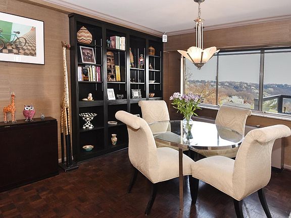Dining area with built in bookshelf spacious