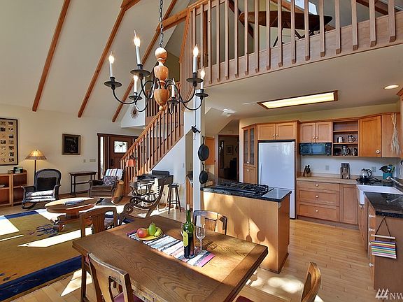 Vaulted Ceilings , open floor plan , hardwood floors and bright view loft 