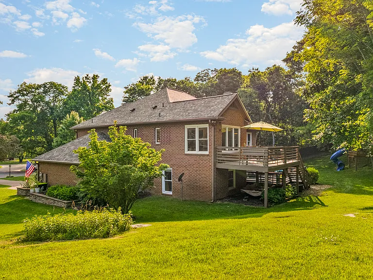 Spacious outdoor living space and backyard at this peaceful family retreat.