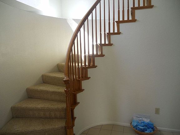 Sweeping stairway up to loft and 2 large bedrooms