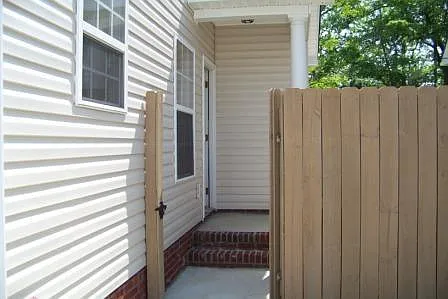 Gate to privacy fenced rear yard.