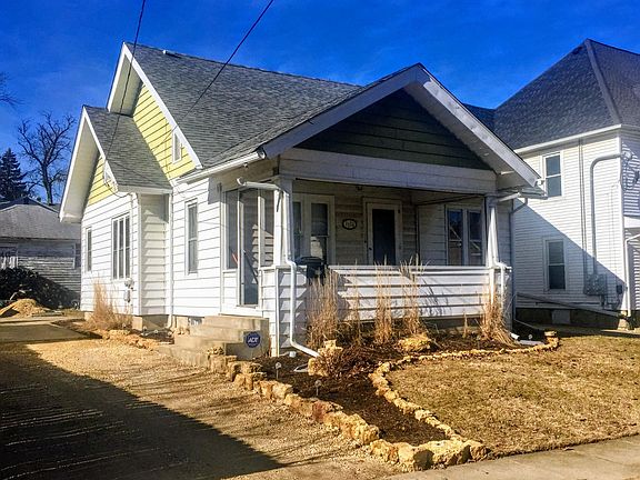 Front and new partial gravel driveway (Southeast view)