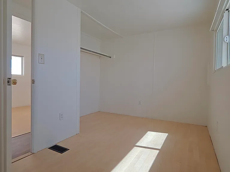 Bedroom three has two closets. The other closet is behind the camera
