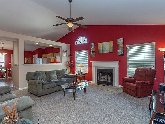 Family room with wood burning fireplace.