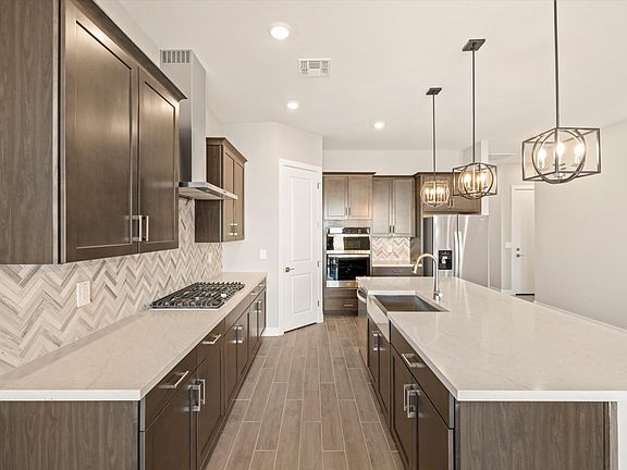 The Arlo floorplan image taken at Abel Ranch featuring a gourmet kitchen.
