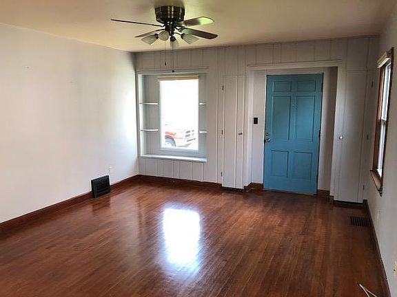 Large living room with great windows letting in so much light! Coat closets on both sides of the fron door.