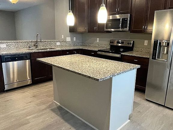 Step into modern elegance at LS Capital Group. This stunning kitchen features sleek stainless steel appliances, a spacious island, and luxurious finishes that make cooking a joy. Elevate your lifestyle and schedule a tour today!