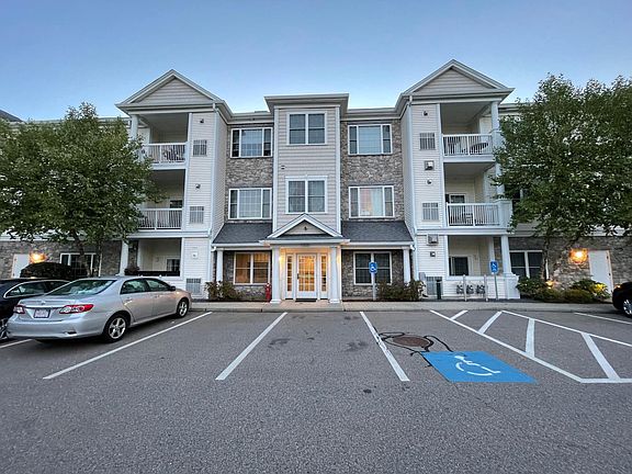 Exterior comes with open parking for visitors or your own overflow cars.