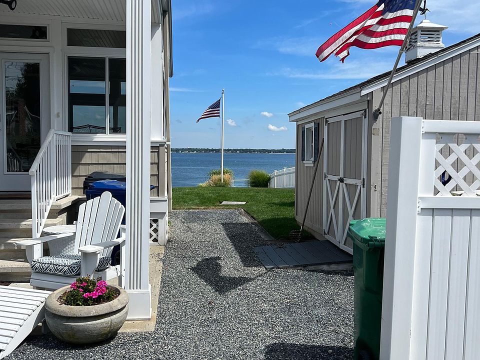 Immediate views approaching the home, as the street parallels the bay. More views upon arriving in the drive.