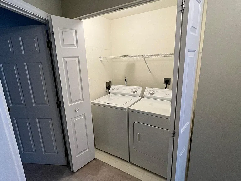 Washer/Drying hook up Upper Level conveniently located in hallway between bedrooms.