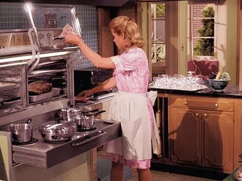 Samantha Stevens of "Bewitched" cooking with her flair 1962