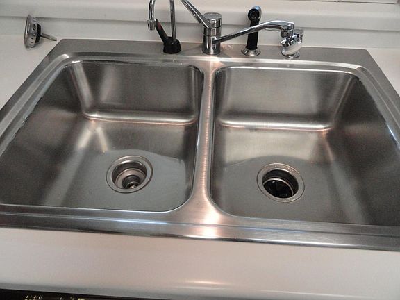 Stainless steel dble sinks with heavy duty disposal.