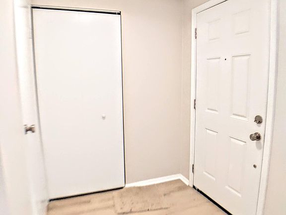 entryway with coat closet