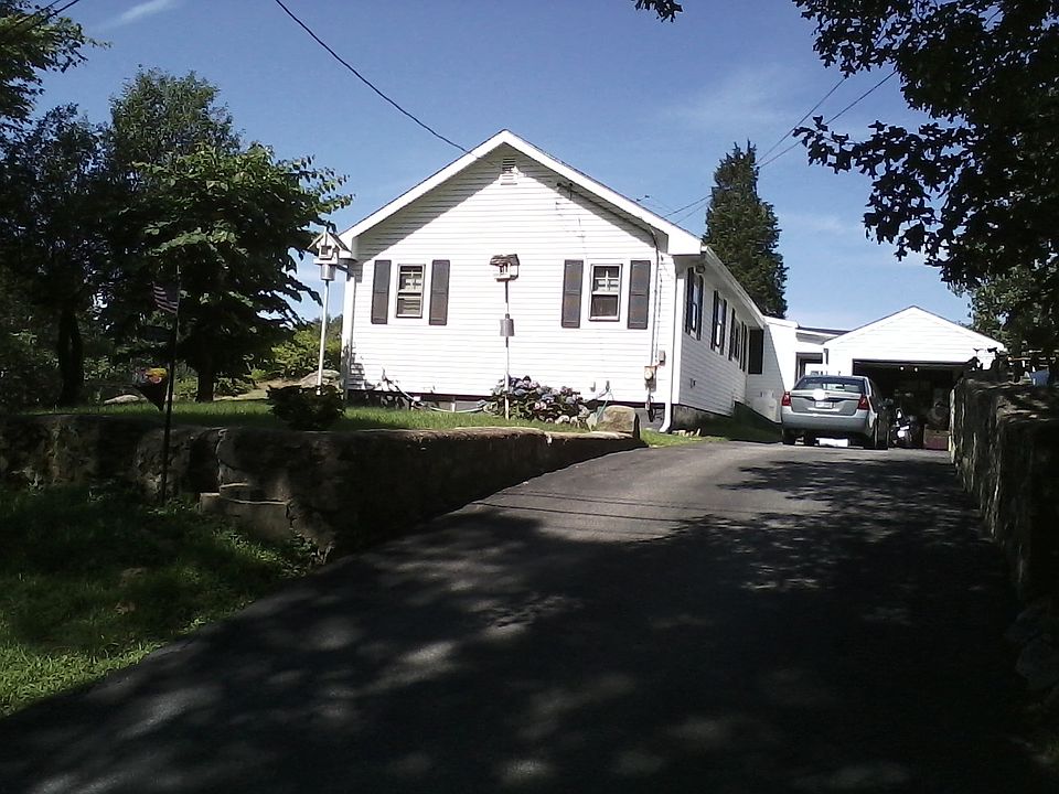 front w/handmade stone walls