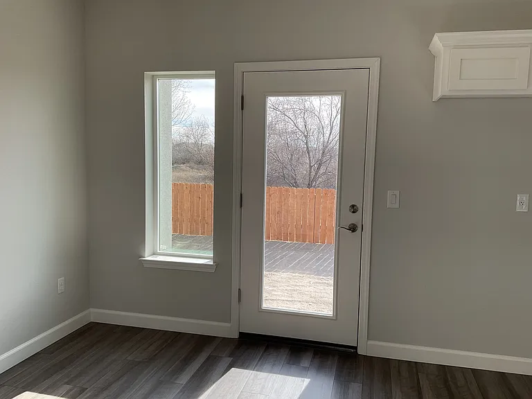 Back door, opens into fenced yard