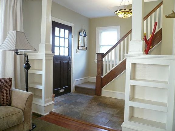 Foyer with natural stone tiles