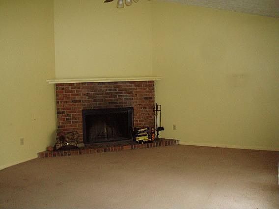 Living room with wood burning fireplace