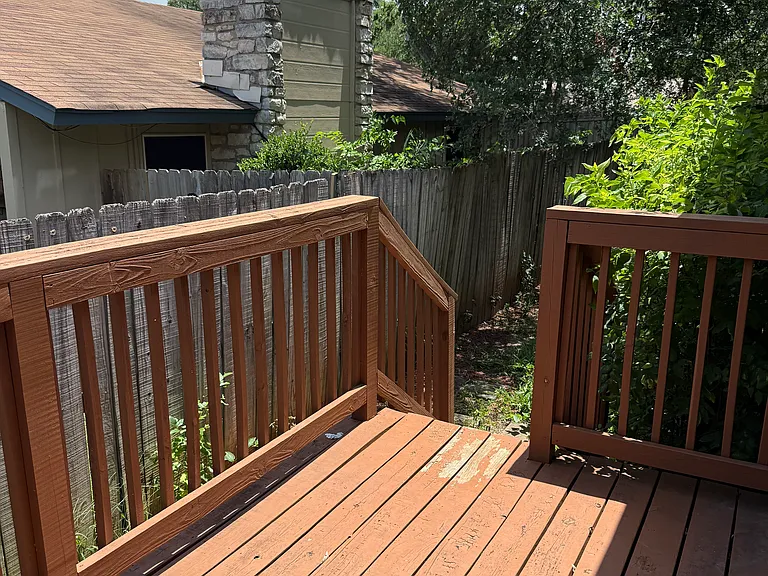 Deck that leads to fully fenced back yard