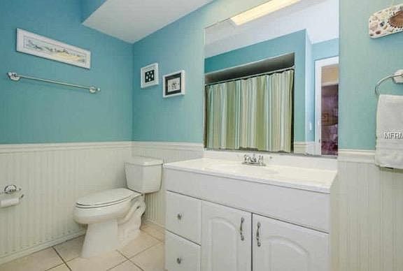 Hall bathroom with tub and shower.