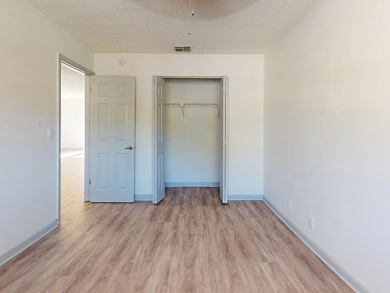 Experience the elegance of this bright bedroom with ample closet space.