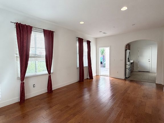 Spacious first-floor family room with abundant natural light and direct access to the patio