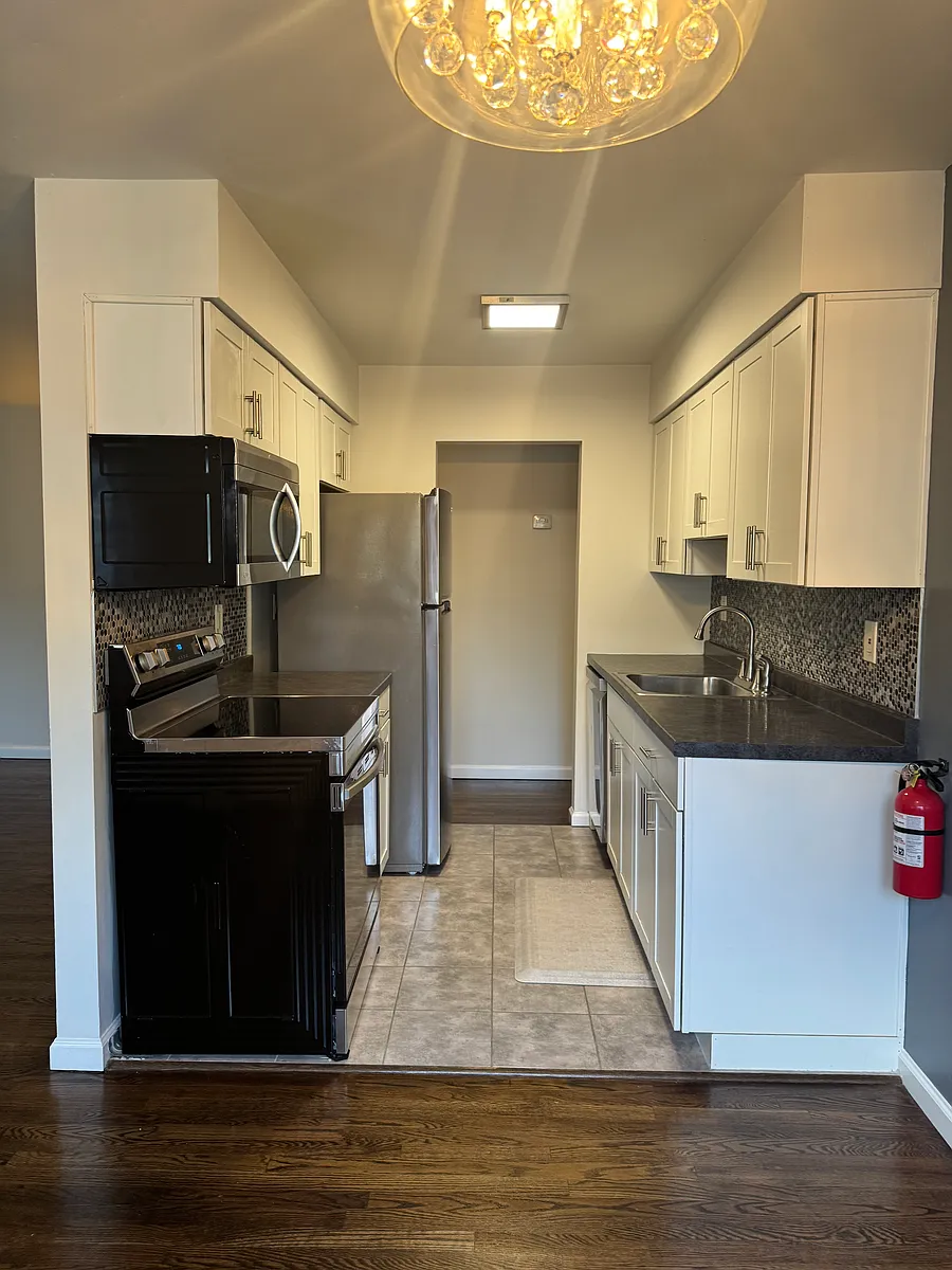 Galley Kitchen with Stainless Steel Appliances. - 59D Stonehurst Blvd #59D