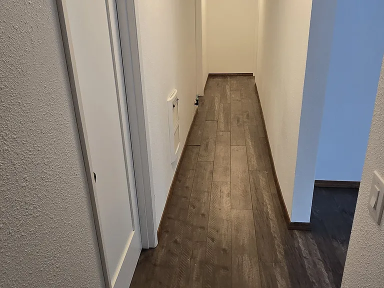 hall to the additional bedrooms and bathroom. Beautifull wood floors