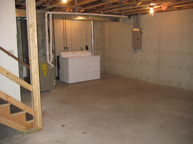 Basement with Washer and Dryer. Excellent for storage or rec room.